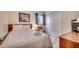 Clean bedroom with a queen bed and simple decor at 1012 N Waccamaw Dr. # 301, Garden City Beach, SC 29576