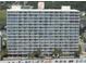 High-rise condo building with multiple balconies overlooking the beach at 1012 N Waccamaw Dr. # 301, Garden City Beach, SC 29576