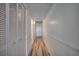 Hallway includes wood look floors and large closet storage at 1012 N Waccamaw Dr. # 301, Garden City Beach, SC 29576