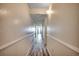 Hallway with wood flooring leading to the ocean view balcony at 1012 N Waccamaw Dr. # 301, Garden City Beach, SC 29576