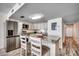 Kitchen island includes stainless appliances, granite countertops, and seating at 1012 N Waccamaw Dr. # 301, Garden City Beach, SC 29576