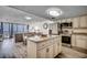 Kitchen with granite counters, island, stainless appliances, and open view at 1012 N Waccamaw Dr. # 301, Garden City Beach, SC 29576
