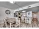 Open-concept kitchen and dining area with stainless steel appliances and breakfast bar at 1012 N Waccamaw Dr. # 301, Garden City Beach, SC 29576