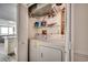 Laundry closet includes washing machine, dryer, storage shelves and a view at 1012 N Waccamaw Dr. # 301, Garden City Beach, SC 29576