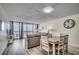 Bright living room with ocean view, dining table, and comfortable seating for a relaxing vacation at 1012 N Waccamaw Dr. # 301, Garden City Beach, SC 29576