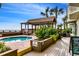 Beautiful pool area featuring a spa and covered seating area near the ocean at 1012 N Waccamaw Dr. # 301, Garden City Beach, SC 29576