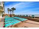 Relax on the oceanfront pool deck with ample lounge chairs and stunning ocean views at 1012 N Waccamaw Dr. # 301, Garden City Beach, SC 29576