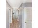 Bright hallway showcases wood floors, doors, and neutral gray walls throughout the home's interior at 1041 True Blue Dr. # 37A, Pawleys Island, SC 29585