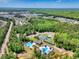 Aerial view of community amenities including pools, tennis courts, and wooded areas at 1048 Longwood Bluffs Circle, Murrells Inlet, SC 29576