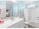 Light and airy bathroom with blue walls, white sink and cabinets, with tub-shower combo at 1048 Longwood Bluffs Circle, Murrells Inlet, SC 29576