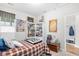 Well-lit bedroom features patterned bedding, artwork, and white built-in bookcase at 1048 Longwood Bluffs Circle, Murrells Inlet, SC 29576