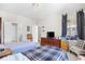 Spacious bedroom with two beds, chest of drawers, and a sitting area at 1048 Longwood Bluffs Circle, Murrells Inlet, SC 29576