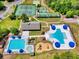 Aerial view showcasing the community pool, playground, and sunbathing areas at 1048 Longwood Bluffs Circle, Murrells Inlet, SC 29576