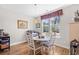 Cozy dining area featuring natural light and hardwood floors with seating for four at 1048 Longwood Bluffs Circle, Murrells Inlet, SC 29576