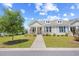 Beautiful home with blue shutters and well-manicured lawn and landscaping at 1048 Longwood Bluffs Circle, Murrells Inlet, SC 29576