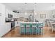 Well-lit kitchen featuring a large center island, stainless steel appliances, and lots of cabinet space at 1048 Longwood Bluffs Circle, Murrells Inlet, SC 29576