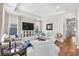 Bright and airy living room featuring hardwood floors, tray ceilings and ample natural light at 1048 Longwood Bluffs Circle, Murrells Inlet, SC 29576