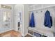 Bright mudroom features storage bench, coat hooks, and access to the outdoors at 1048 Longwood Bluffs Circle, Murrells Inlet, SC 29576
