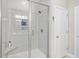 Modern shower features a glass door, built in shower bench, with tiled walls at 1048 Longwood Bluffs Circle, Murrells Inlet, SC 29576