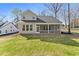 Spacious backyard with a screened porch, ideal for relaxation and outdoor living at 1061 Edenton Dr., Calabash, NC 28467