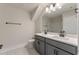 Bright bathroom featuring double sink vanity, modern fixtures, and sleek gray cabinets at 1061 Edenton Dr., Calabash, NC 28467