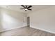 Simple bedroom with light wood floors, a ceiling fan, and white trim at 1061 Edenton Dr., Calabash, NC 28467