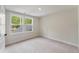 Bedroom features neutral carpet, neutral walls, white trim, and natural light at 1061 Edenton Dr., Calabash, NC 28467