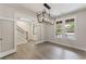 Elegant dining room featuring modern lighting and staircase access at 1061 Edenton Dr., Calabash, NC 28467