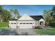 Beautiful home exterior with a three car garage and manicured lawn at 1061 Edenton Dr., Calabash, NC 28467