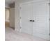 Hallway featuring carpet and closet with paneled doors at 1061 Edenton Dr., Calabash, NC 28467