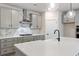Modern kitchen with quartz countertops, gray cabinetry, stainless steel appliances, and designer backsplash at 1061 Edenton Dr., Calabash, NC 28467