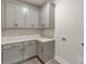 Functional laundry room with plenty of cabinet and counter space at 1061 Edenton Dr., Calabash, NC 28467