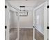 Bright living room with stylish light fixture and modern glass doors at 1061 Edenton Dr., Calabash, NC 28467