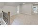 Open loft with carpet floors, neutral paint, and transom window at 1061 Edenton Dr., Calabash, NC 28467