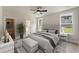 Staged primary bedroom with neutral walls, natural light, and ensuite bathroom at 1061 Edenton Dr., Calabash, NC 28467