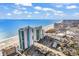 An aerial view shows Oceans One Resort with ocean frontage, beach access, and city views at 107 S Ocean Blvd. # 1001, Myrtle Beach, SC 29577