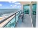 Spacious balcony with seating, overlooking the sandy beach and ocean waves at 107 S Ocean Blvd. # 1001, Myrtle Beach, SC 29577
