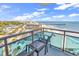 Relaxing balcony space with seating, showcasing beautiful city and ocean views at 107 S Ocean Blvd. # 1001, Myrtle Beach, SC 29577