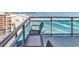 Inviting balcony space with chairs and views of the ocean at 107 S Ocean Blvd. # 1001, Myrtle Beach, SC 29577