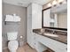 Bathroom featuring a spacious vanity and a large mirror at 107 S Ocean Blvd. # 1001, Myrtle Beach, SC 29577