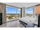 Bright bedroom with large windows providing stunning views of the surrounding landscape at 107 S Ocean Blvd. # 1001, Myrtle Beach, SC 29577