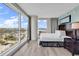 Inviting bedroom with expansive windows, offering a scenic view of the ocean and nearby town at 107 S Ocean Blvd. # 1001, Myrtle Beach, SC 29577