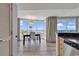 Bright dining room with floor-to-ceiling windows showcasing ocean views at 107 S Ocean Blvd. # 1001, Myrtle Beach, SC 29577