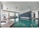 The indoor pool area features a hot tub, decorative tiling and large windows at 107 S Ocean Blvd. # 1001, Myrtle Beach, SC 29577