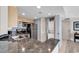Charming kitchen includes stainless steel appliances, tile floor, and in-unit laundry at 107 S Ocean Blvd. # 1001, Myrtle Beach, SC 29577
