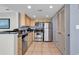 Well-equipped kitchen with granite countertops, stainless steel appliances, and a laundry closet at 107 S Ocean Blvd. # 1001, Myrtle Beach, SC 29577