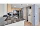The kitchen has stainless steel appliances, beautiful counters, and a stacked washer and dryer at 107 S Ocean Blvd. # 1001, Myrtle Beach, SC 29577