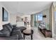 Spacious living room with balcony access and comfortable furnishings at 107 S Ocean Blvd. # 1001, Myrtle Beach, SC 29577
