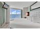 Serene main bedroom with ocean views, natural light, and minimalist decor at 107 S Ocean Blvd. # 1001, Myrtle Beach, SC 29577