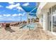 Relaxing poolside with multiple chairs on a sunny day with ocean views and covered seating at 107 S Ocean Blvd. # 1001, Myrtle Beach, SC 29577